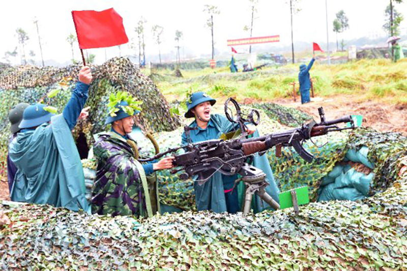 Thực binh Trung đội súng máy phòng không 12,7 ly của dân quân đánh trả địch tấn công đường không