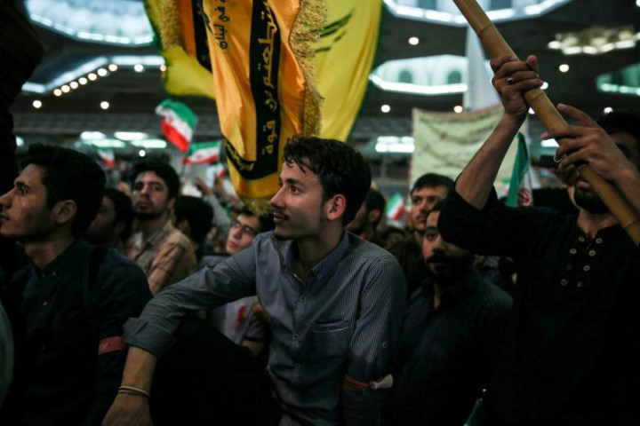 Chùm ảnh: Cử tri Iran sẵn sàng bỏ lá phiếu quyết định vận mệnh khu vực - Hình 12