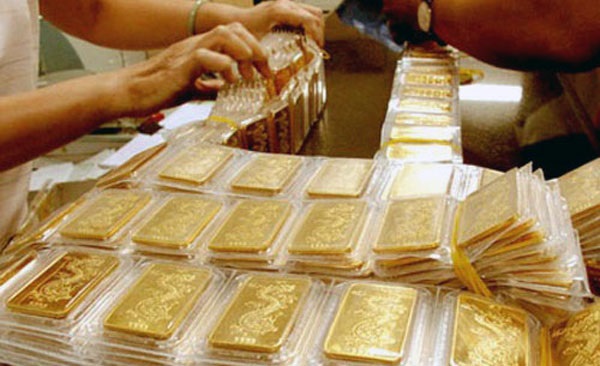 Giá vàng hôm nay 26/3: Giá vàng lên đỉnh, đồng USD sụt giảm - Hình 1