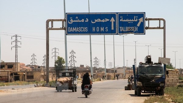 Quân đội Syria đạt thỏa thuận sơ tán trại tị nạn Yarmouk - Hình 1