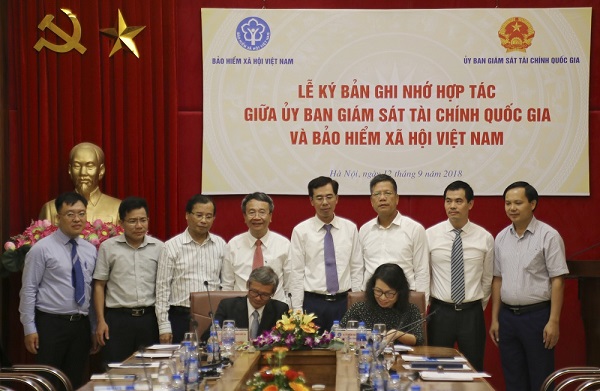 BHXH Việt Nam và Ủy ban Giám sát tài chính Quốc gia ký bản ghi nhớ hợp tác - Hình 1