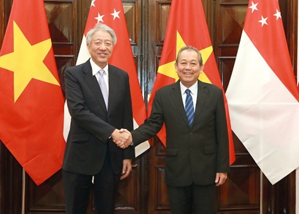 Phó Thủ tướng Trương Hòa Bình hội đàm Phó Thủ tướng Singapore Tiêu Chí Hiền - Hình 1