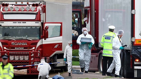 Nhân viên pháp y kiểm tra chiếc xe container có 39 thi thể (Ảnh Reuters)