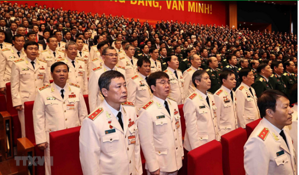 Đoàn đại biểu Đảng bộ Công an Trung ương và Đảng bộ Quân đội dự phiên khai mạc Đại hội. (Ảnh: TTXVN)