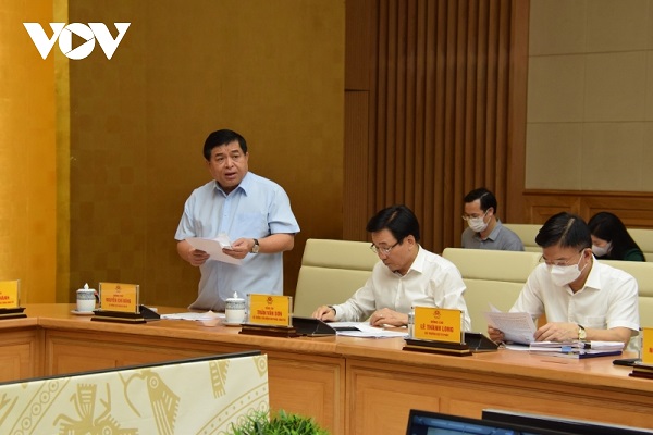 Bộ trưởng Bộ Kế hoạch và Đầu tư Nguyễn Chí Dũng báo cáo tại Hội nghị
