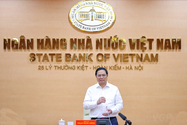 Thủ tướng Phạm Minh Chính bày tỏ mong muốn các ngân hàng thương mại cùng chia sẻ với Đảng, Nhà nước, nhân dân, tạo ra nguồn lực, sức mạnh phát triển mới. Ảnh VGP/Nhật Bắc