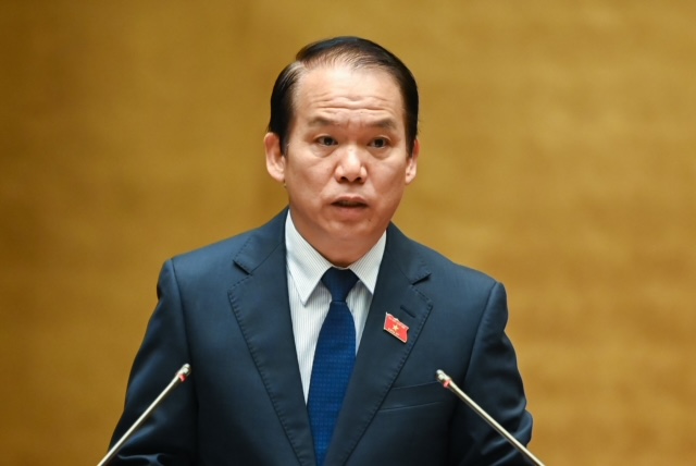 Chủ nhiệm Ủy ban Pháp luật Hoàng Thanh Tùng trình bày Báo cáo thẩm tra dự thảo Nghị quyết - Ảnh: VGP/Nhật Bắc