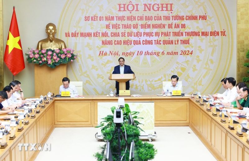 Thủ tướng Phạm Minh Chính chủ trì Hội nghị sơ kết 01 năm thực hiện tháo gỡ vướng mắc thực hiện Đề án 06. (Ảnh: Dương Giang/TTXVN)