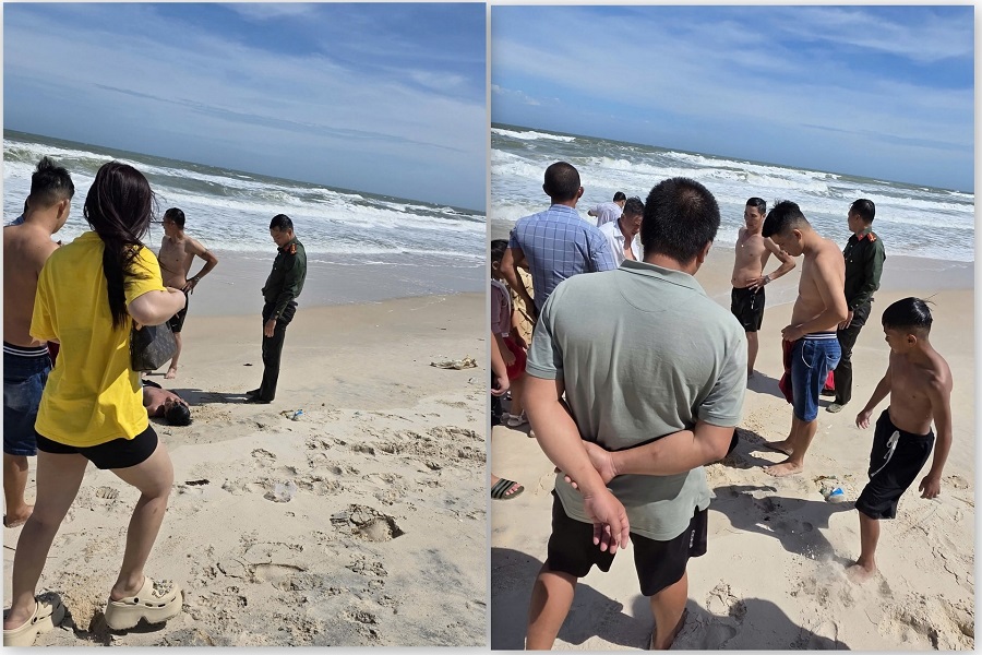 Thời điểm 2 ch&aacute;u nhỏ được đưa l&ecirc;n bờ sau khi được c&ocirc;ng an c&ugrave;ng người d&acirc;n ứng cứu